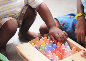 Child picking crayons